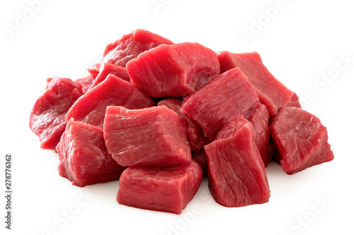Pile of beef cubes isolated on white. photo