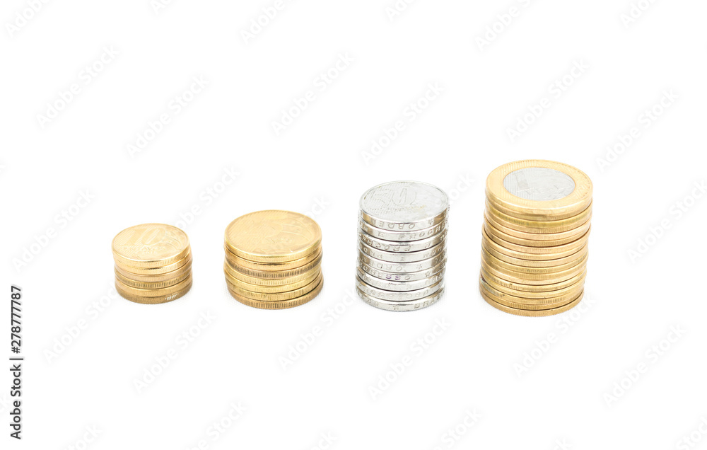Close-up Brazilian currency money, white background. Coins of savings. Brazil. Selective focus. Growing business and future concept, coins stack. Close-up Brazilian currency money, white background. Coins of savings. Brazil. Selective focus. Growing business and future concept, coins stack.