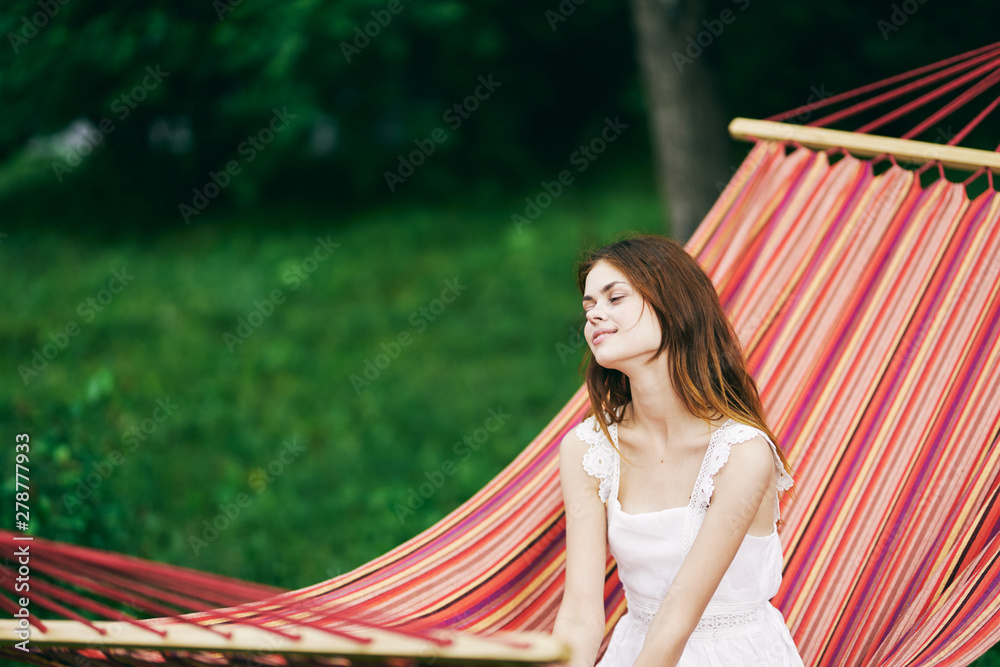 Fototapeta premium beautiful woman on green leaves park nature