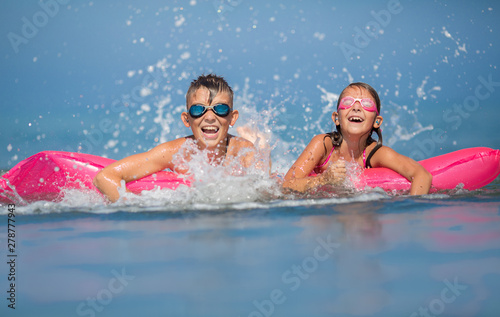 Summertime. Children swimming and having fun together