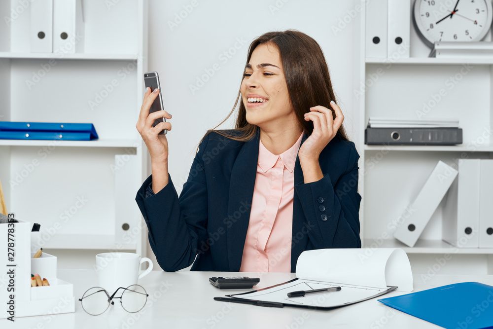 businesswoman talking on phone in office businesswoman talking on phone in office