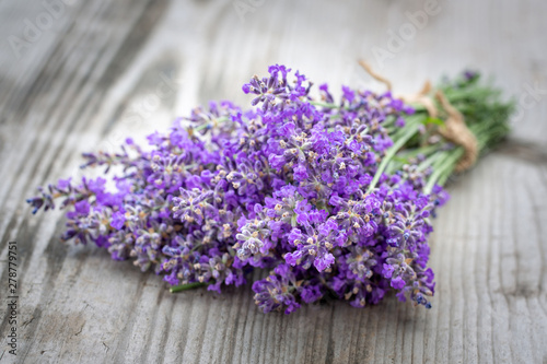 Bouquets of lavender on wooden background. Medicinal plants. Aromatherapy.