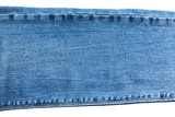Denim and jeans background, part of jeans with seams, long, isolated