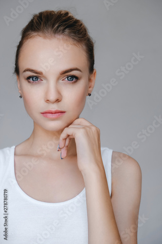 Beauty woman face blue eyes healthy skin closeup natural makeup