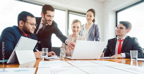 Team of office workers discussing business development