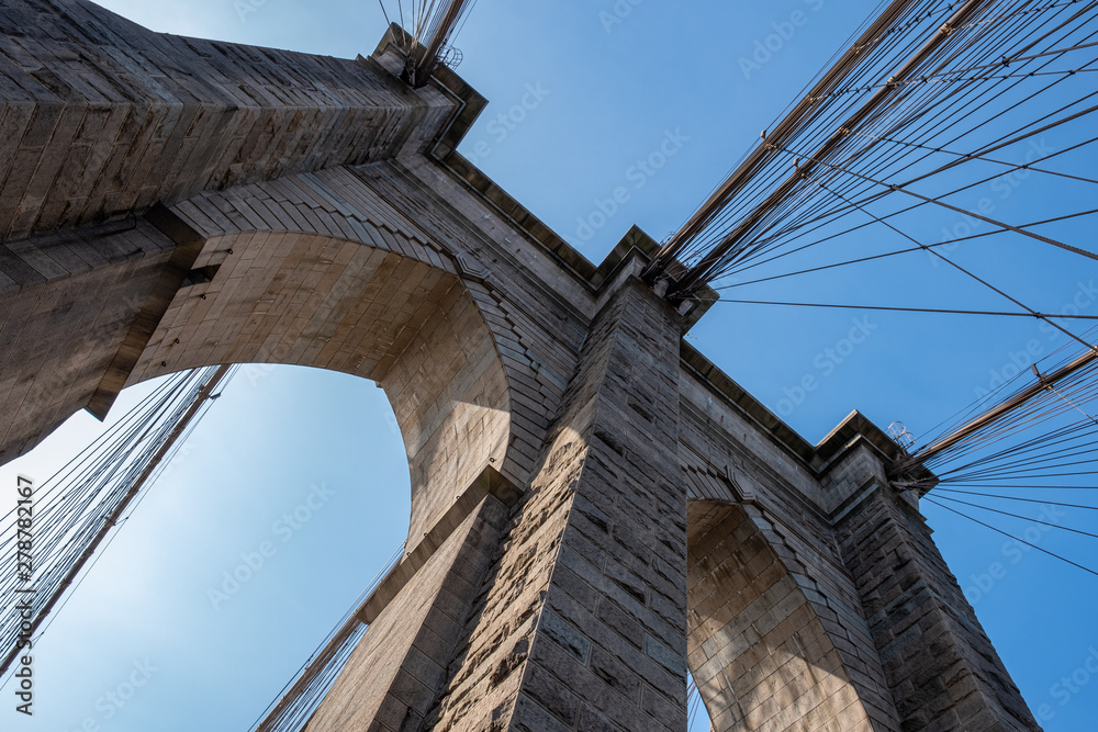 Fototapeta premium Close up view of Brooklyn Bridge in summer sunny daylight