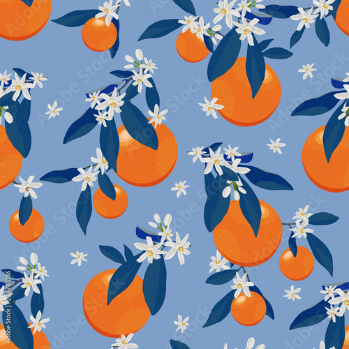 Orange fruits seamless pattern with flowers and blue leaves on blue  background. Grapefruit citrus fruit vector illustration.