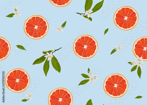 Orange fruits slice seamless pattern with flowers and leaves on pastel blue background. Grapefruit citrus fruit vector illustration.
