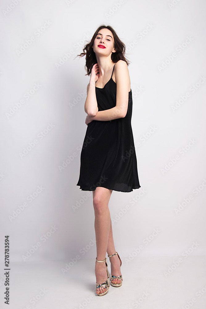 little black dress beautiful fashion model posing isolated in studio little black dress beautiful fashion model posing isolated in studio