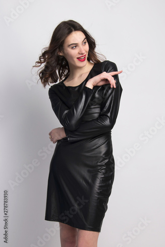 little black dress  beautiful fashion model posing isolated in studio