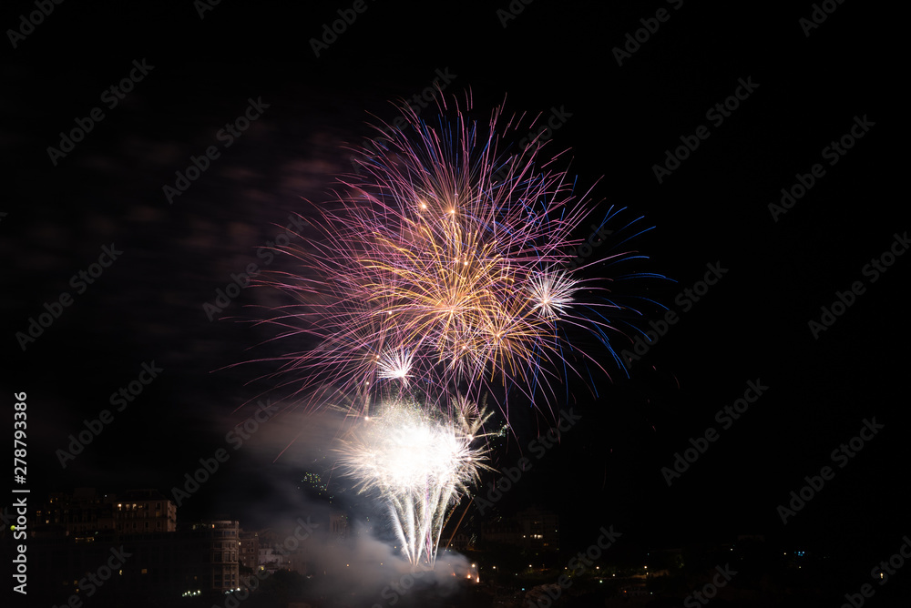 Firework celebrating Bastille Day in Biarritz city. Basque Country of France.