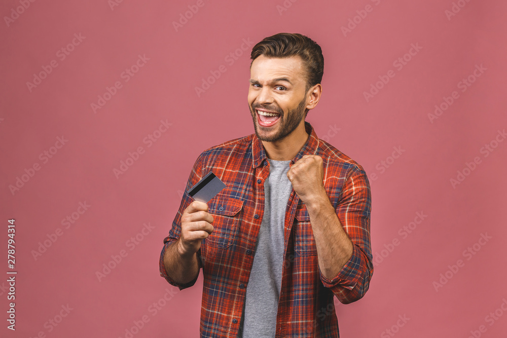 Young casual man standing with credit card and shouting Young casual man standing with credit card and shouting