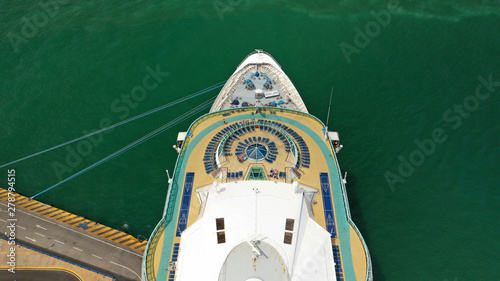 Aerial top view photo of cruise liner docked in famous port of Mykonos island, Cyclades, Greece © aerial-drone