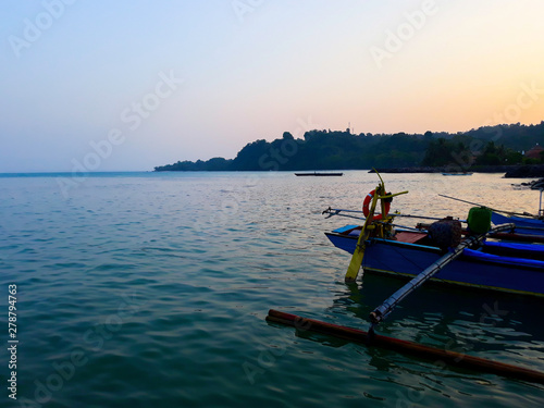 Traditional sailing wooden boat on the water parking at the harbour in summer holiday in Lampung, Indonesia © syahrir