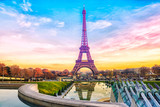 Eiffel Tower at sunset in Paris, France. Romantic travel background