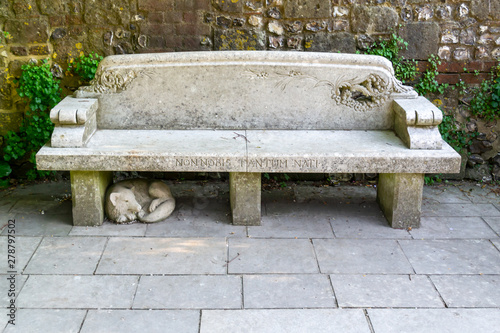 beautiful old stone bench with label 