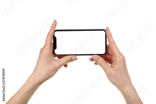 Smartphone in female hands isolated on white background