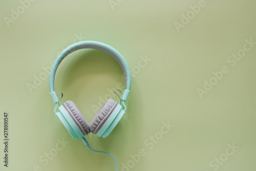 Headphones on green backgro...