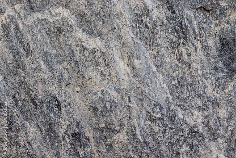 Dark gray stone porous surface. Gran abstract stone surface. Texture of stone.