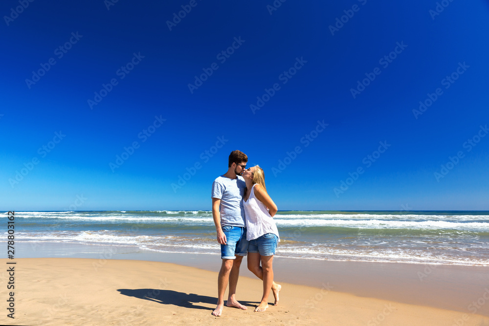 Happy couple spend time on the beach.