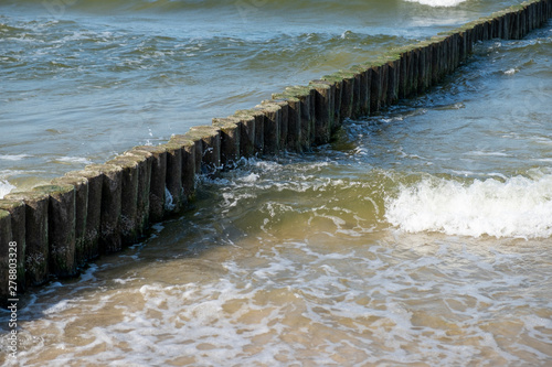 Fototapeta Naklejka Na Ścianę i Meble -  View to the Baltic Sea with its groynes at the beach of Zempin.