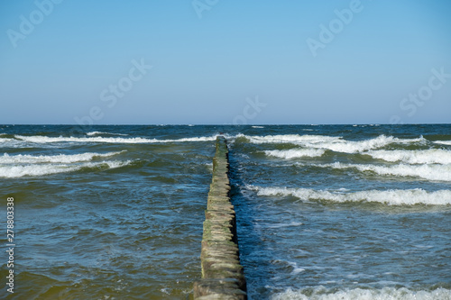 Fototapeta Naklejka Na Ścianę i Meble -  View to the Baltic Sea with its groynes at the beach of Zempin.
