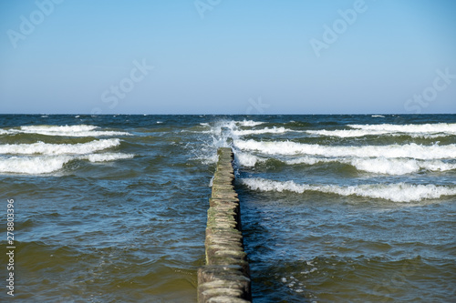 Fototapeta Naklejka Na Ścianę i Meble -  View to the Baltic Sea with its groynes at the beach of Zempin.