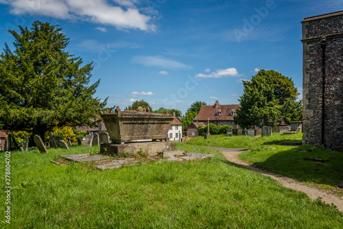 Churchyard of St Mary Magdalene parish church built in 13th century, Cobham, England, UK