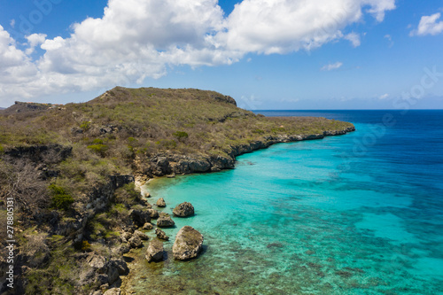 Fototapeta Naklejka Na Ścianę i Meble -  Aerial view of coast of Curaçao in the  Caribbean Sea with turquoise water, white sandy beach and beautiful coral reef at Playa Manzalina 