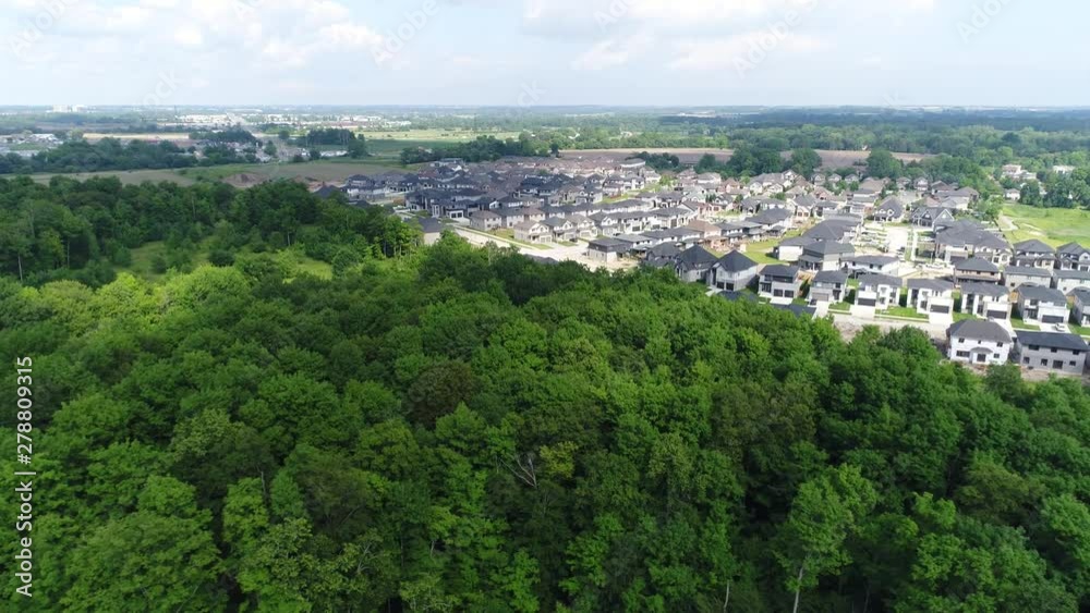Aerial Flying Over Luscious Green Forest Towards New Housing Complex Development Aerial Flying Over Luscious Green Forest Towards New Housing Complex Development