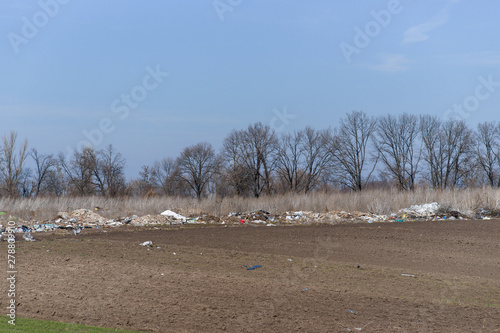 Trash on the agriculture field. Ecology problem and big harm to nature.