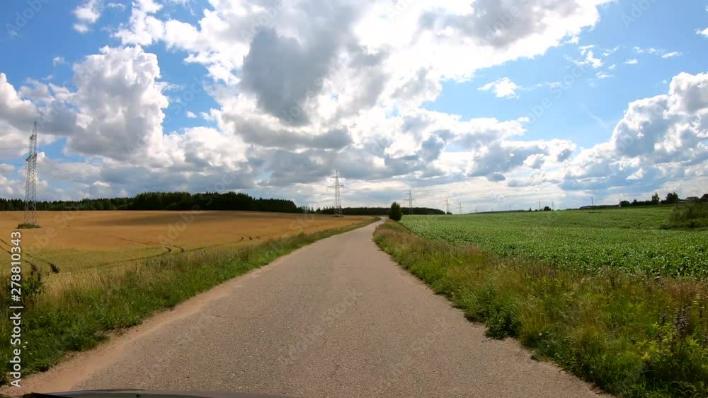 Travel by car on narrow country roads. View from hood. Slow motion