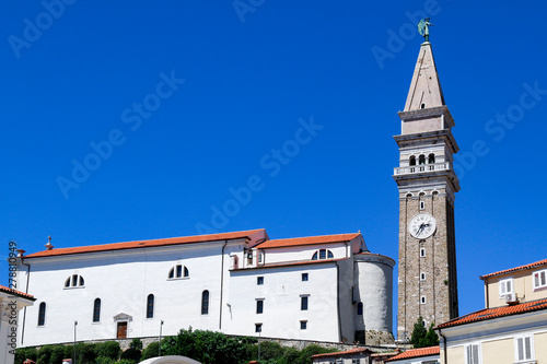 Low angle view of St George's Church and bell tower in Piran, Slovenia