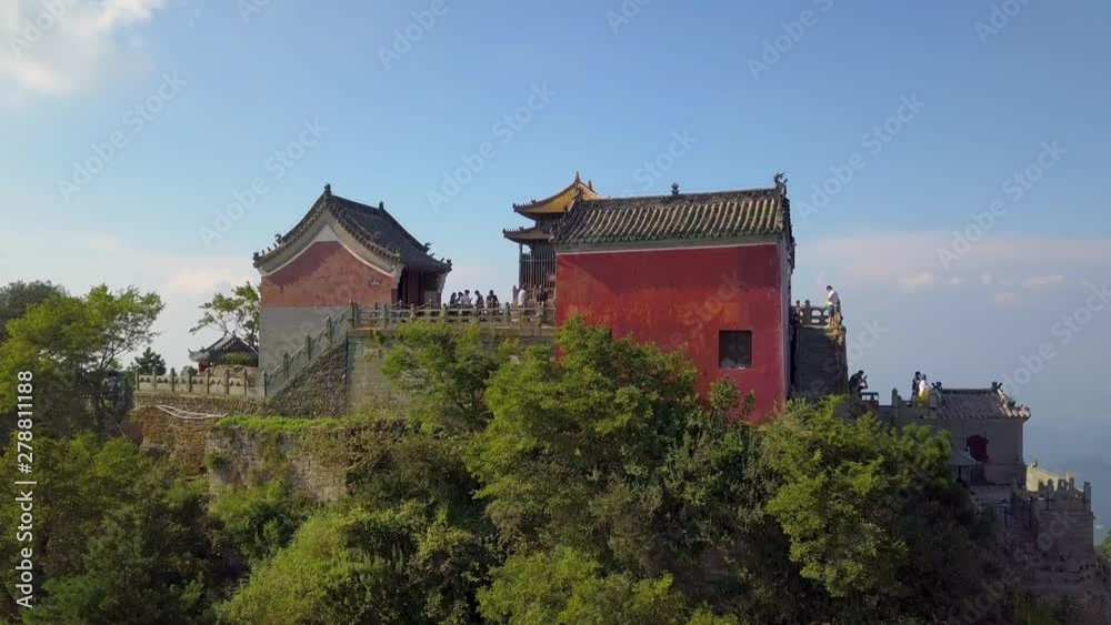 Aerial views to Taihe Palace. The main palace of Golden Summit. Best example of imperial architecture by Ming Dynasty.It was built in 1416 in Yongle. Tianzhu Peak in Wudangshan Mountains, Hubei provi Aerial views to Taihe Palace. The main palace of Golden Summit. Best example of imperial architecture by Ming Dynasty.It was built in 1416 in Yongle. Tianzhu Peak in Wudangshan Mountains, Hubei provi