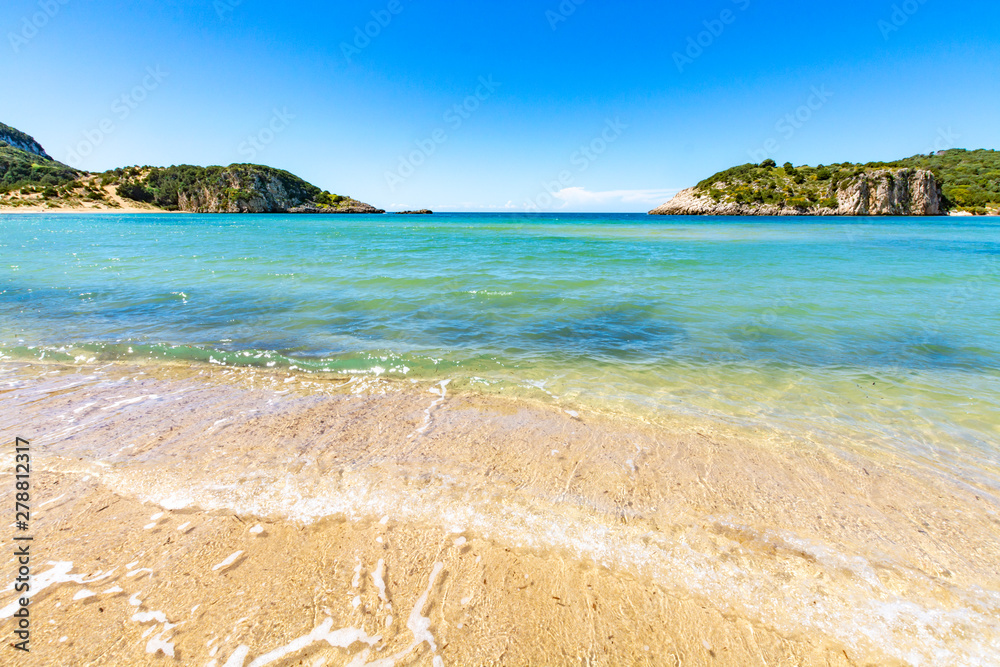 Obraz premium Voidokilia Beach, popular white sand and blue clear water beach in Messinia in Mediterranean area in shape of Greek letter omega, Peloponnese, Greece.