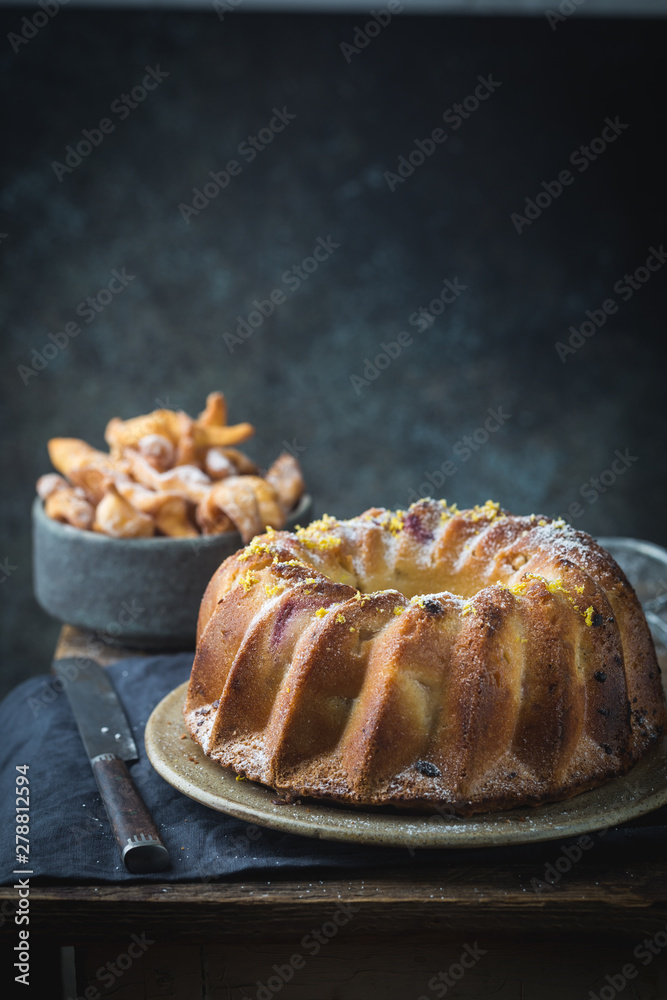 Rustic Style Apple Bundt Cake Sprinkled with Icing Sugar on old wooden table Rustic Style Apple Bundt Cake Sprinkled with Icing Sugar on old wooden table