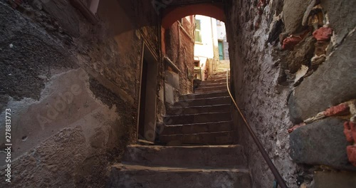 Wonderful medieval narrow street with stone stairs in the old city. Walking around beautiful vintage town during summer vacation.