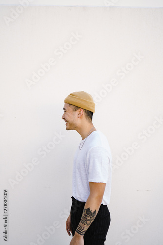 Side view of smiling man standing outdoors