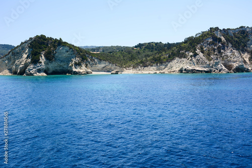 View from the ship while cruising around the beautiful Greek island in the Ionian Sea with a beautiful blue turquoise sea.