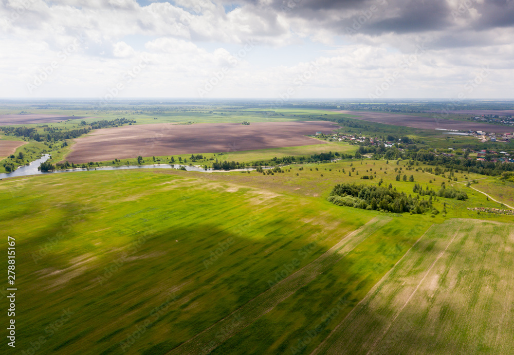 View of fields in the middle lane of Russia at summer day