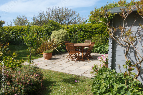 фотографія Terrace and wooden furniture in a garden