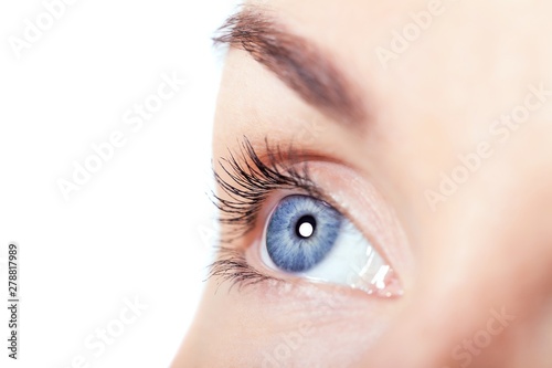 Fototapeta Naklejka Na Ścianę i Meble -  Human eye on blue background (shallow DoF)