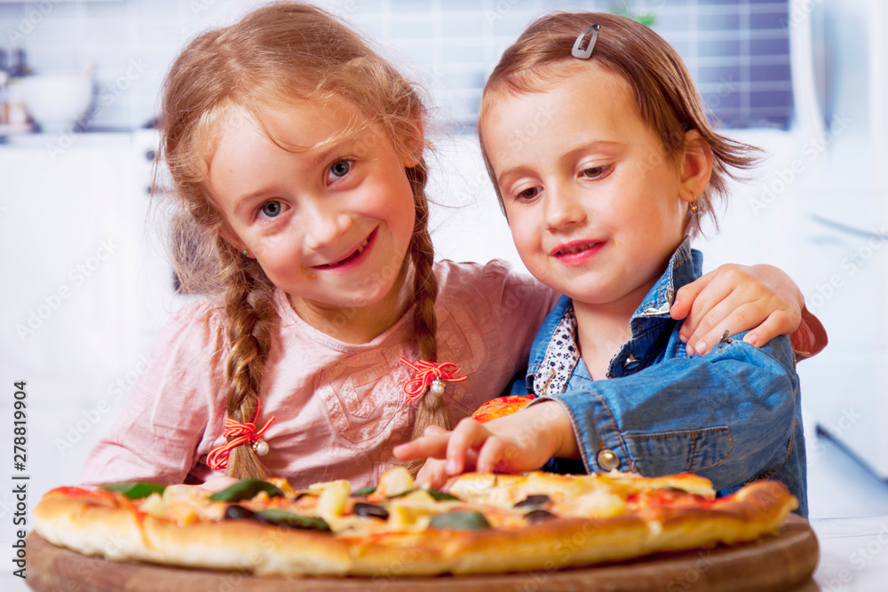 Cute little girls best friends eating pizza. Cute little girls best friends eating pizza.
