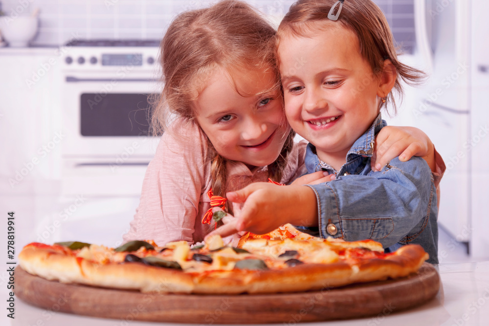 Cute little child girls best friends eating pizza. Cute little child girls best friends eating pizza.