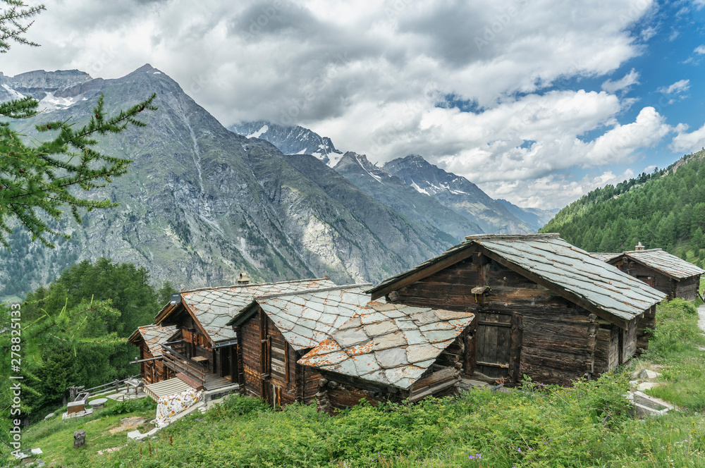 Obraz premium traditional wooden houses in the village of Tufteren, high above Zermatt, the famous touristic destination in the canton Valais, Wallis, Switzerland