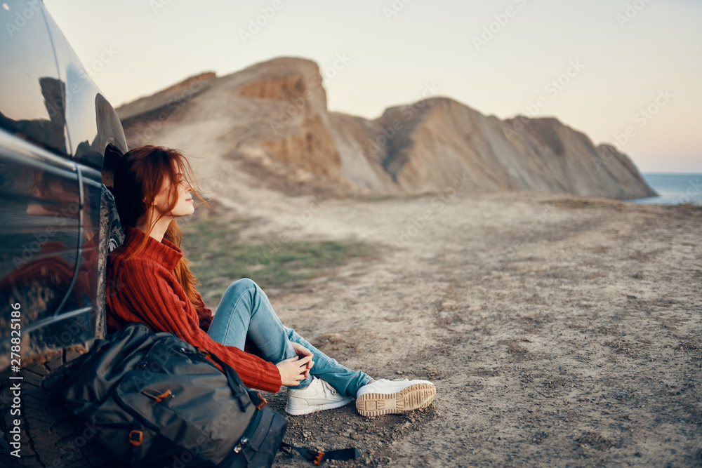 woman sitting on the beach