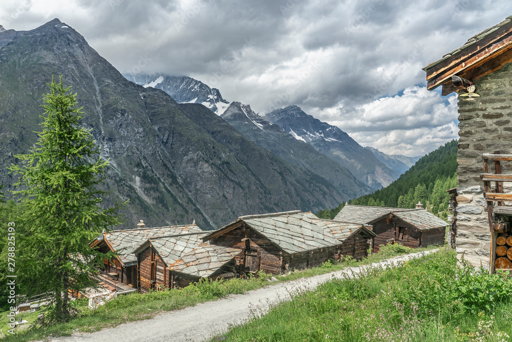 traditional wooden houses in the village of Tufteren, high above Zermatt, the famous touristic destination in the canton Valais, Wallis, Switzerland