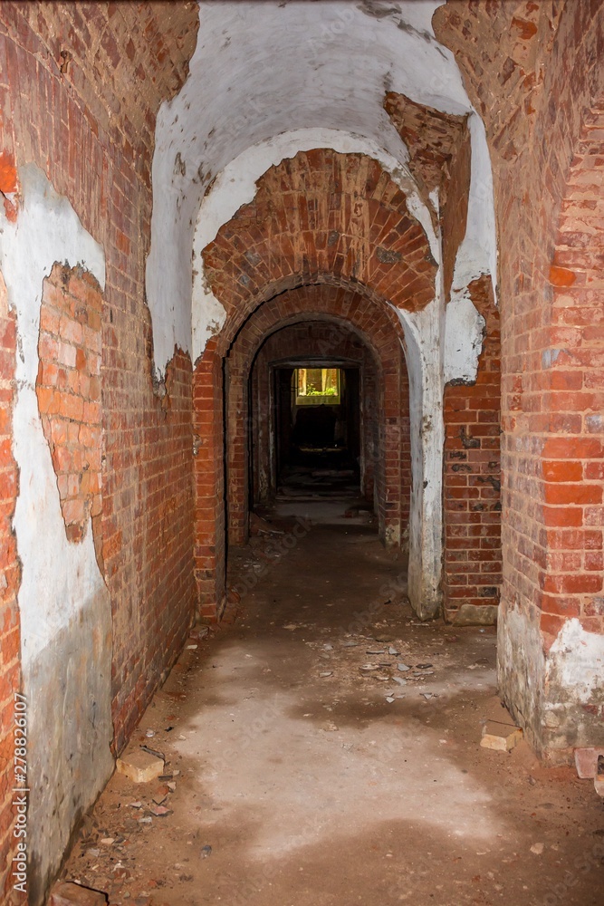 A long corridor in the basement of an abandoned house. Manor Stepanovskoe-Pavlishchevo 19th century. Pavlishchev-Bor, Kaluzhskiy region, Russia