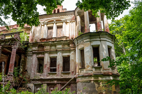 The ruins of the palace Yaroshenko late 19th century in the estate Stepanovskoe-Pavlishchevo, fragment of the southern facade. Sanatorium Pavlishchev-Bor, Kaluzhskiy region, Russia - July 2019 photo