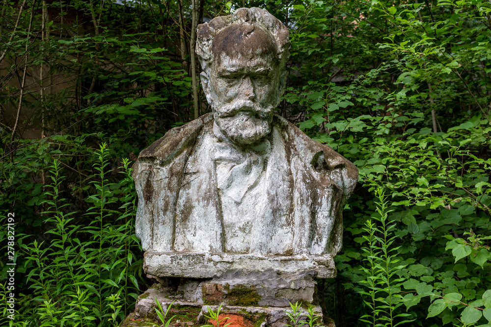 Old damaged bust to Russian composer Pyotr Ilyich Tchaikovsky (Chaikovskiy) on the territory of an abandoned sanatorium Old damaged bust to Russian composer Pyotr Ilyich Tchaikovsky (Chaikovskiy) on the territory of an abandoned sanatorium